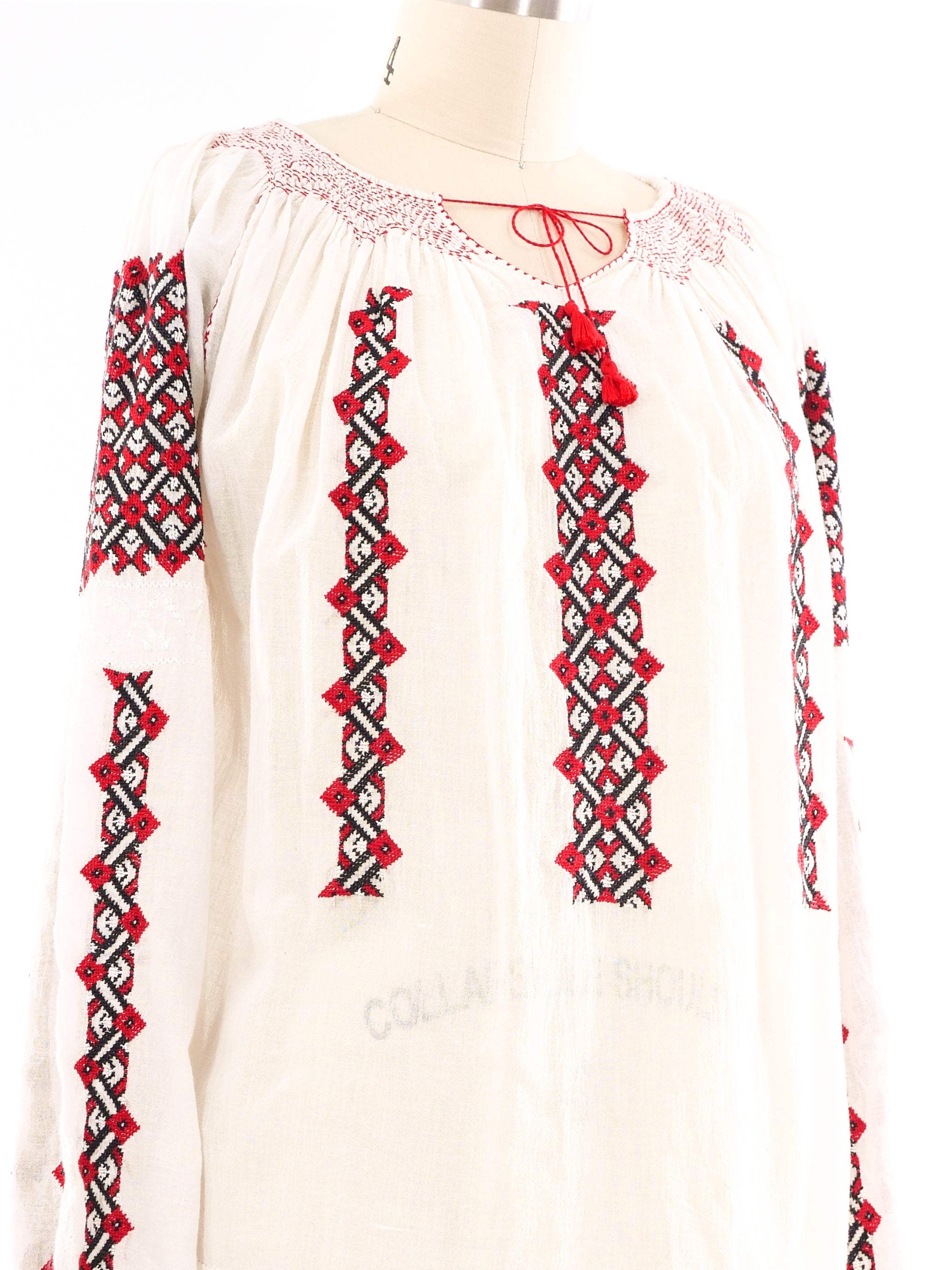 white peasant blouse with red embroidery